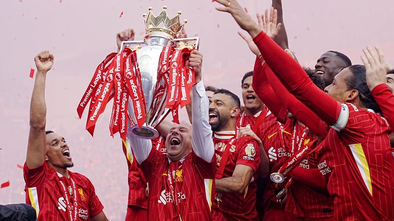 Liverpool manager Arne Slot lifts the Premier League trophy