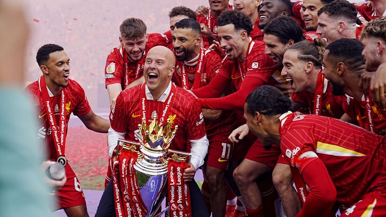 Liverpool manager Arne Slot lifts the Premier League trophy