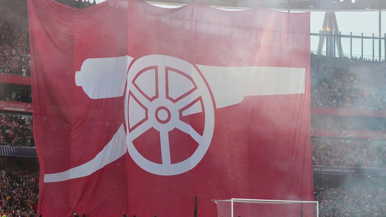 Supporters held a large Arsenal flag between Arsenal and Paris Saint-Germain in London, England before the Champions League semi-final first leg football match between Arsenal and Paris Saint-Germain in London, England.