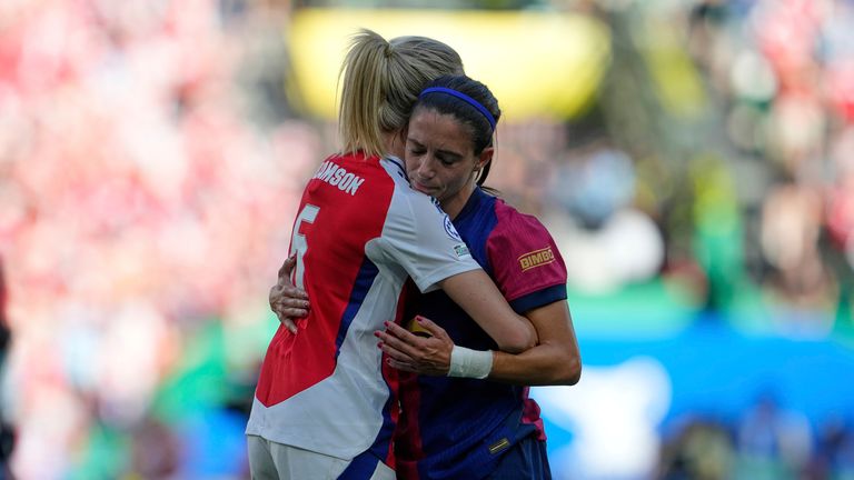 Barcelona's Aitana Bonmati, right, greets Arsenal's Leah Williamson at the end of the women's Champions League final soccer match between Arsenal and FC Barcelona at the Jose Alvalade stadium in Lisbon, Saturday, May 24, 2025. (AP Photo/Armando Franca)