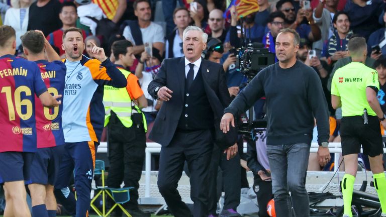 Carlo Ancelotti and Hansi Flick coach during the match between FC Barcelona and Real Madrid