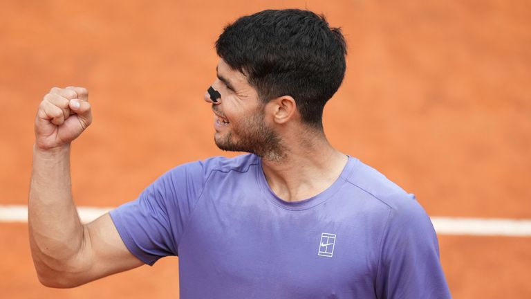 Spain's Carlos Alcaraz celebrates after defeating Britain's Jack Draper in their quarter-final tennis match at the Italian Open at the Foro Italico, in Rome, Wednesday, May 14, 2025.(AP Photo/Alessandra Tarantino)
