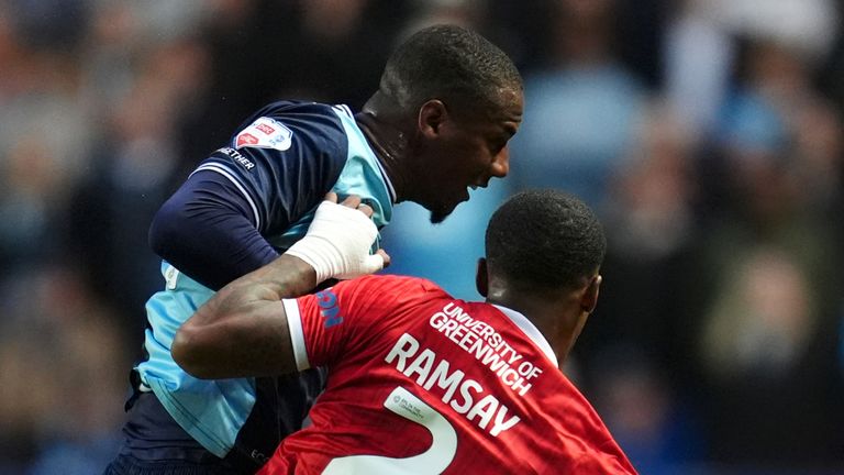 Charlton Athletic's Kayne Ramsay and Wycombe Wanderers' Richard Kone battle for the ball 