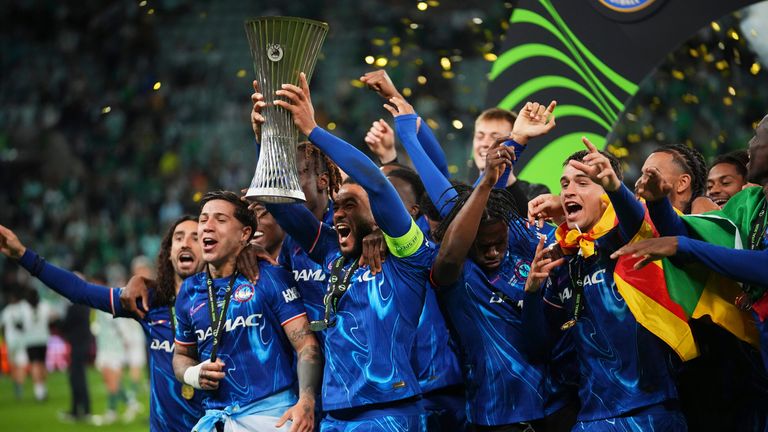 Chelsea players celebrate with a cup after the final football match for the European League between Real Betis and Chelsea in Warkelo, Poland, Wednesday, May 28, 2025 (AP Photo/Petr David Josek)
