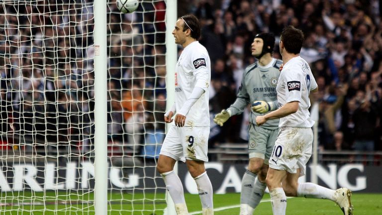 Tottenham Hotspur's Dimitar Berbatov, left, celebrates after scoring a penalty goal against Chelsea during the League Cup Final soccer match at Wembley Stadium in London, Sunday Feb. 24, 2008.