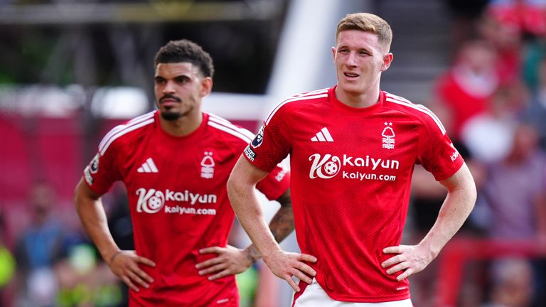 Elliot Anderson and Morgan Gibbs-White appear dejected after Leicester City score their second goal