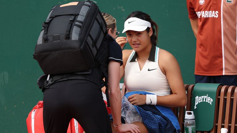 Emma Raducanu of Great Britain receives treatment during a break in play during her Women's Singles First Round match against Wang Xinyu of People's Republic of China on Day Two of the 2025 French Open at Roland Garros on May 26, 2025 in Paris, France. (Photo by Julian Finney/Getty Images)