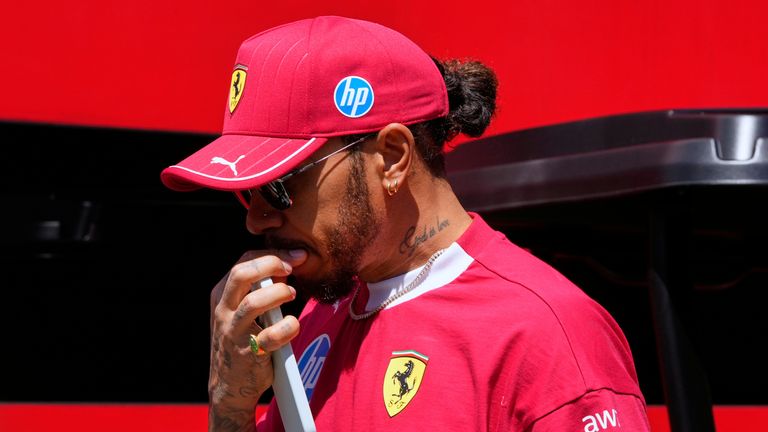 Ferrari driver Lewis Hamilton of Britain arrives prior to the first free practice at the Enzo and Dino Ferrari racetrack, ahead the Italy's Emilia Romagna Formula One Grand Prix, in Imola, Italy, Friday, May 16, 2025. (AP Photo/Luca Bruno)