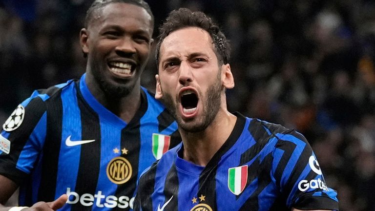 Inter Milan's Hakan Calhanoglu celebrates after scoring his side's second goal during the Champions League semifinal second leg soccer match between Inter Milan and Barcelona at San Siro stadium in Milan , Italy, Tuesday, May 6, 2025. (AP Photo/Luca Bruno)