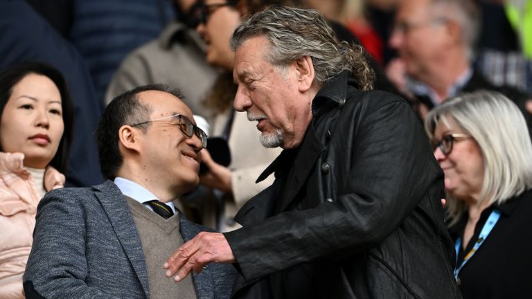 Wolverhampton Wanderers chief-executive Jeff Shi shakes hands with Wolverhampton Wanderers Vice-President Robert Plant prior to the Premier League match between Wolverhampton Wanderers FC and Tottenham Hotspur FC at Molineux on April 13, 2025 in Wolverhampton, England.