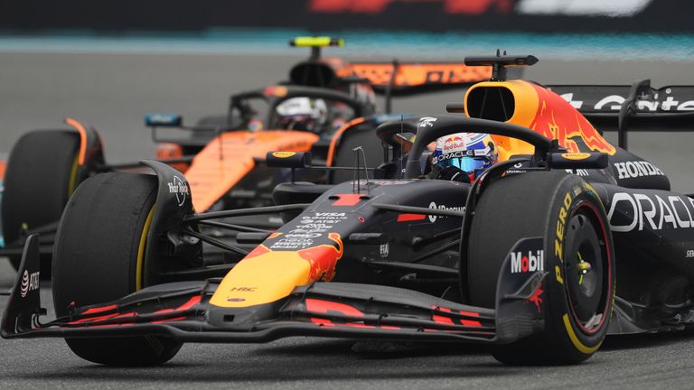 Red Bull driver Max Verstappen of the Netherlands races past McLaren driver Lando Norris of Britain during the Formula One Miami Grand Prix auto race Sunday, May 4, 2025, in Miami Gardens. Fla. (AP Photo/Rebecca Blackwell)