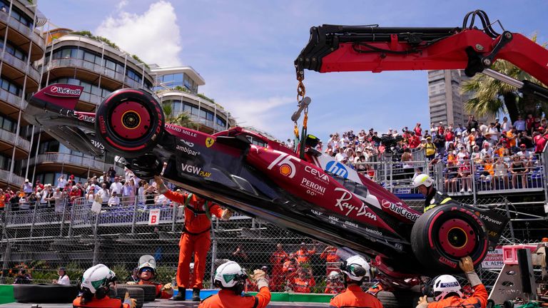 The car of Ferrari driver Lewis Hamilton of Britain is lifted for towing after a crash during the third free practice ahead of the Formula One Monaco Grand Prix race at the Monaco racetrack in Monaco, Saturday, May 24, 2025. (AP Photo/Manu Fernandez)