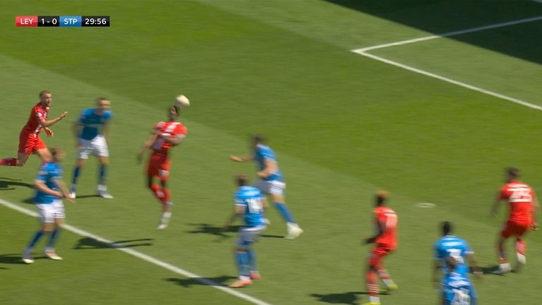 Omar Beckles flicks the ball on for Charlie Kelman