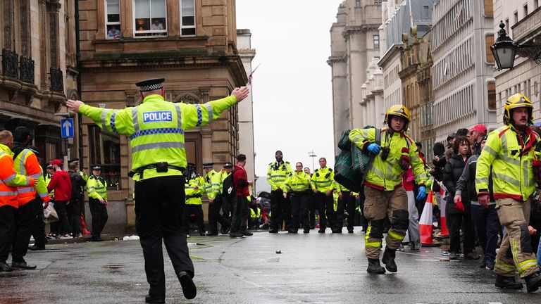Police and emergency personnel dealing with a road traffic accident on Water Street near the Liver Building in Liverpool after a car collided with pedestrians during the Premier League winners parade. A man has been detained. Picture date: Monday May 26, 2025.