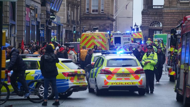 Police and emergency personnel dealing with a road traffic accident on Water Street near the Liver Building in Liverpool after a car collided with pedestrians during the Premier League winners parade. A man has been detained. Picture date: Monday May 26, 2025.