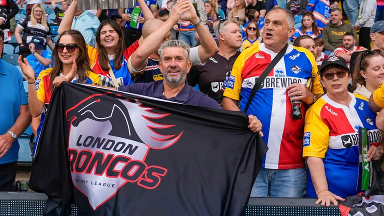 Picture by Olly Hassell/SWpix.com - 17/08/2024 - Rugby League - Betfred Super League Magic Weekend - Hull FC v London Broncos - Elland Road, Leeds, England - London Broncos fans celebrate their teams victory over Hull FC