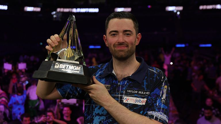 LONDON, ENGLAND - MAY 29: Luke Humphries of England poses with the trophy after winning The Final of the 2025 BetMGM Premier League Darts Play-Offs at The O2 Arena on May 29, 2025 in London, England. (Photo by Andrew Redington/Getty Images)