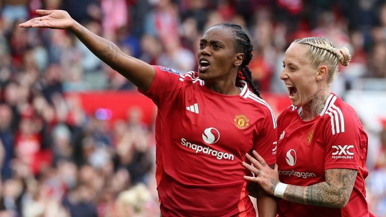 Melvine Malard celebrates with team-mate Leah Galton after drawing Man Utd level with Man City