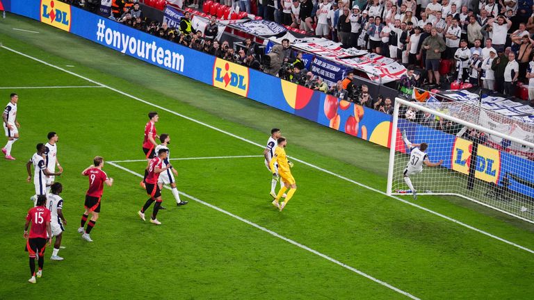 Micky Van de Ven acrobatically clears off the line