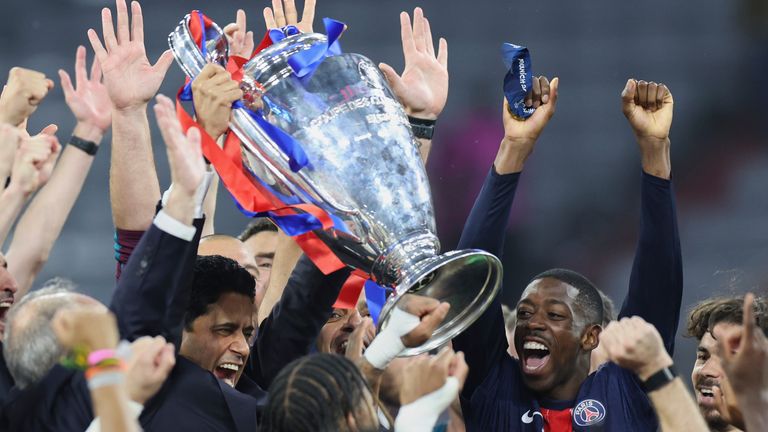 PSG President Nasser Al-Khelaifi lisfts the trophy after the Champions League final soccer match between Paris Saint-Germain and Inter Milan at the Allianz Arena in Munich, Germany, Saturday, May 31, 2025. (AP Photo/Alexandra Beier)