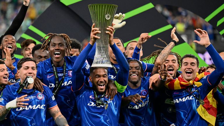 Reese James from Chelsea raises the cup after the final football match of the European League between Real Betis and Chelsea in Rocco, Poland, Wednesday, May 28, 2025. (AP Photo/Denes Erdos)