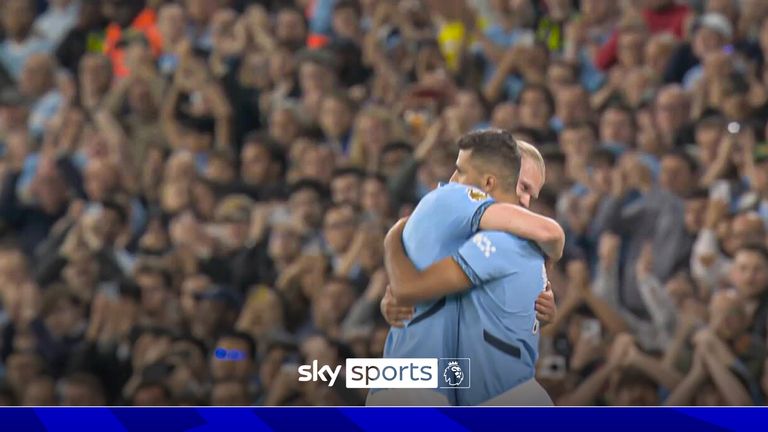 Rodri hugs Erling Haaland