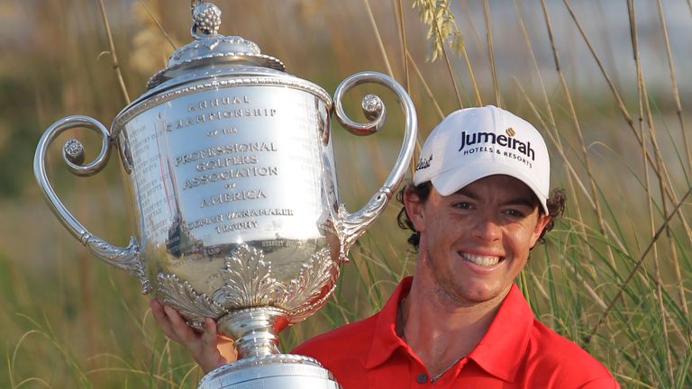 Rory McIlroy from Northern Ireland Posizes for Championship Cups after the last round of the PGA Championship Golf Tournament in the Ocean Golf Course on Kiawah Island on Kiawah, SC, Sunday, August 12, 2012 (AP Photo/John Raux)   