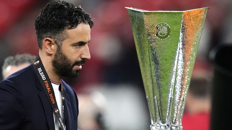 Ruben Amorim walks past the Europa League trophy after Man Utd's defeat to Tottenham
