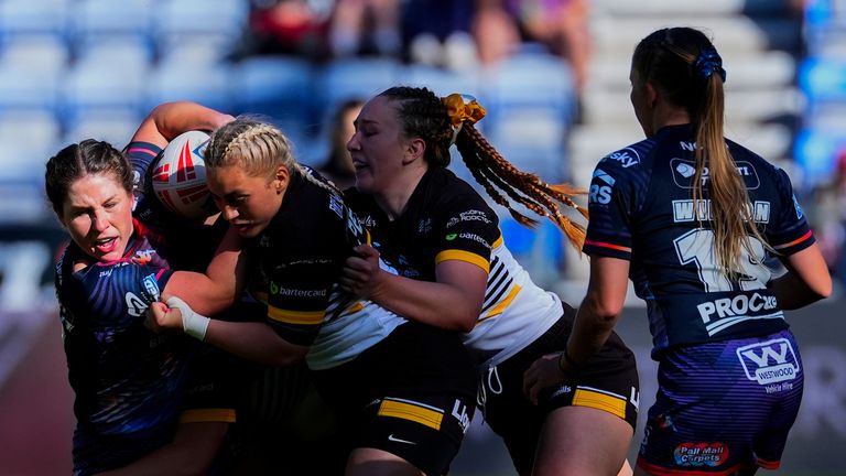 Picture by Olly Hassell/SWpix.com - 16/05/2025 - Rugby League - Betfred Women's Super League Round 1 - Wigan Warriors v York Valkyrie - The Brick Community Stadium, Wigan, England - Jade Gregory-Haselden of Wigan is tackled by Sinead Peach of York