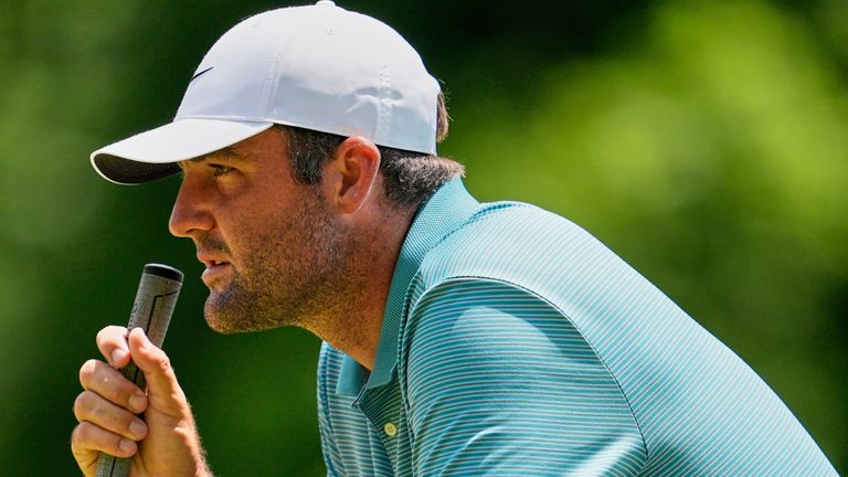 Scottie Scheffler lines up a putt on the fourth hole during the third round of the PGA Championship golf tournament at the Quail Hollow Club, Saturday, May 17, 2025, in Charlotte, N.C. (AP Photo/George Walker IV)