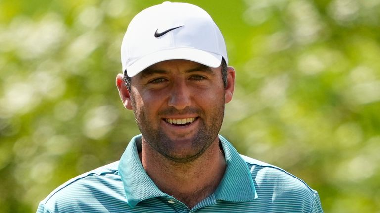 Scottie Scheffler smiles on the seventh hole during the third round of the PGA Championship golf tournament at the Quail Hollow  Club, Saturday, May 17, 2025, in Charlotte, N.C. (AP Photo/Matt York) 