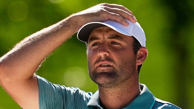 Scottie Scheffler reacts to his bunker shot on the 13th hole during the third round of the PGA Championship golf tournament at the Quail Hollow Club, Saturday, May 17, 2025, in Charlotte, N.C. (AP Photo/David J. Phillip)