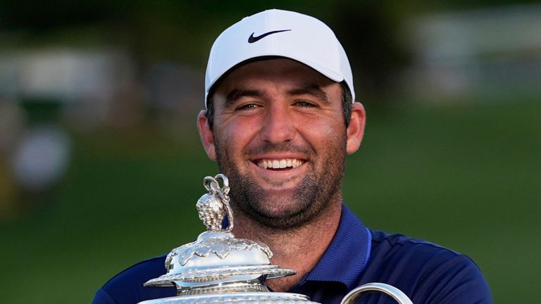Scottie Scheffler holds the Wanamaker trophy after winning the PGA Championship golf tournament at the Quail Hollow Club, Sunday, May 18, 2025, in Charlotte, N.C. (AP Photo/David J. Phillip)