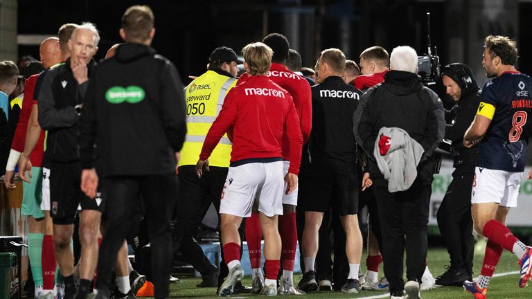 An altercation takes place between Livingston fans and the Ross County coaching staff at full-time of the first leg of their play-off final