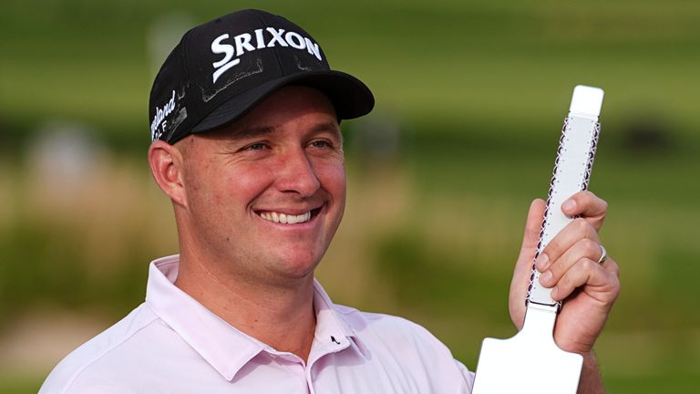 Sepp Straka, of Austria, poses with the trophy after winning the Truist Championship golf tournament at the Philadelphia Cricket Club, Sunday, May 11, 2025, in Flourtown. (AP Photo/Matt Rourke) 