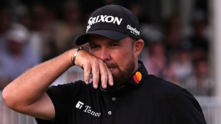 Shane Lowry, of Ireland, wipes his face on the 18th hole during the final round of the Truist Championship golf tournament at the Philadelphia Cricket Club, Sunday, May 11, 2025, in Flourtown. (AP Photo/Matt Rourke) 