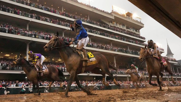 Junior Alvarado celebrates after riding Sovereignty to victory in the 151st running of the Kentucky Derby