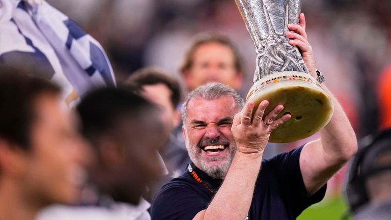 Tottenham's head coach Ange Postecoglou celebrates winning a trophy in his second sesaon at Spurs