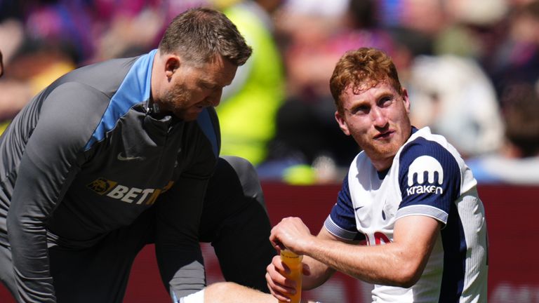 Tottenham Hotspur's Dejan Kulusevski receives treatment during the Premier League match at Tottenham Hotspur Stadium, London. Picture date: Sunday May 11, 2025