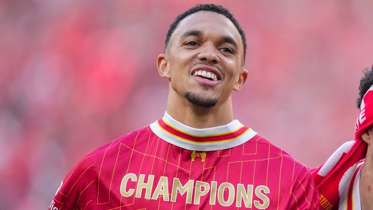 Liverpool's Trent Alexander-Arnold, left, and Curtis Jones celebrate after winning the English Premier League soccer match between Liverpool and Tottenham Hotspur and clinching the Premier League title at Anfield in Liverpool, England, Sunday, April 27, 2025. (AP Photo/Jon Super)