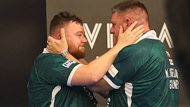 Josh Rock and Daryl Gurney embrace after winning the World Cup of Darts for Northern Ireland