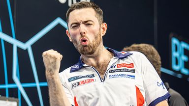 Luke Humphries celebrates at the BetVictor World Cup of Darts in 2024