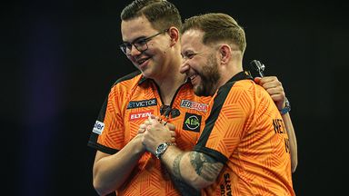 The Netherlands' Gian van Veen and Danny Noppert celebrate after winning their first match at the 2025 World Cup of Darts