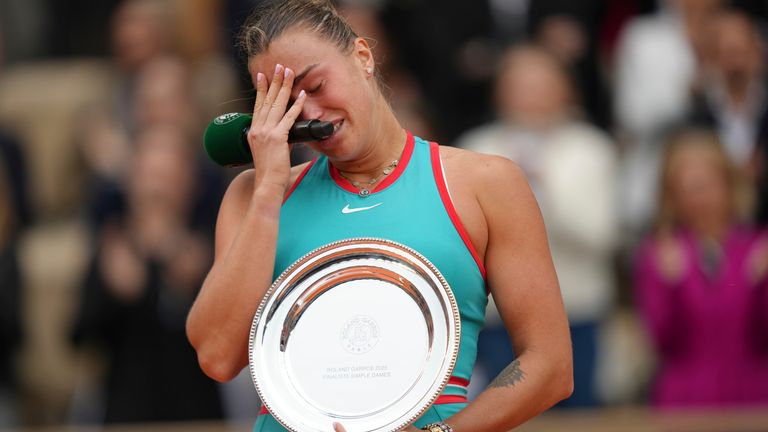 Second placed Aryna Sabalenka of Belarus reacts with the trophy after the final match of the French Tennis Open against Coco Gauff of the U.