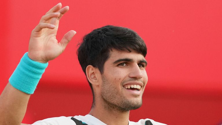 Carlos Alcaraz of Spain celebrates winning match point against Jaume Munar of Spain, during the Queen's Club Tennis Championships in London, Thursday, June 19, 2025. (AP Photo/Kirsty Wigglesworth)