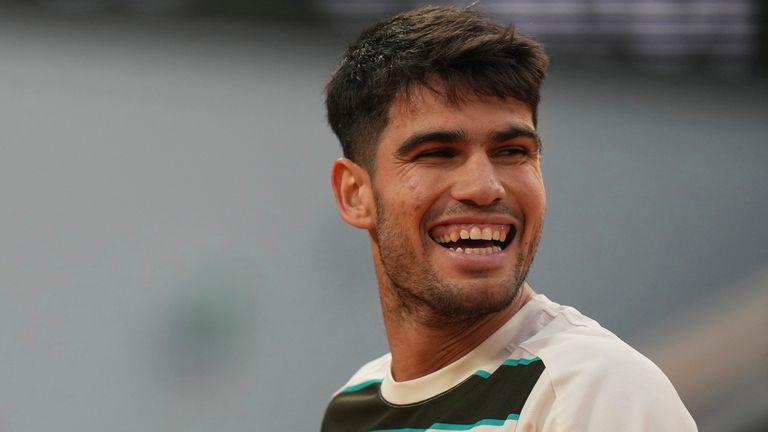 Spain's Carlos Alcaraz smiles as he plays against Tommy Paul of the U.S. during their quarterfinal match of the French Tennis Open at the Ro