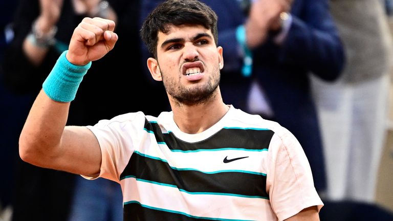Spain's Carlos Alcaraz reacts after winning a game during his men's singles final match against Italy's Jannik Sinner on day 15 of the Frenc