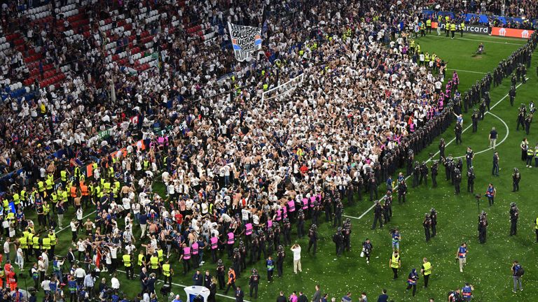 PSG supporters entered the field in the Allianz Arena after the team won the Champions League final