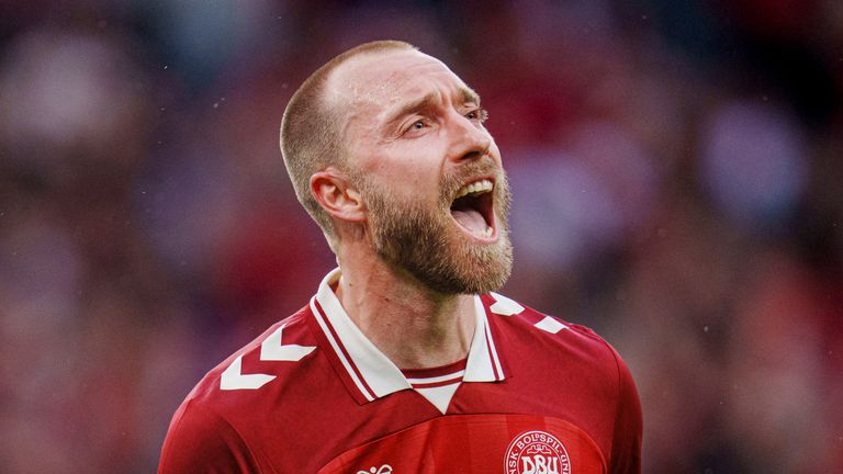 Christian Eriksen celebrates scoring the winner