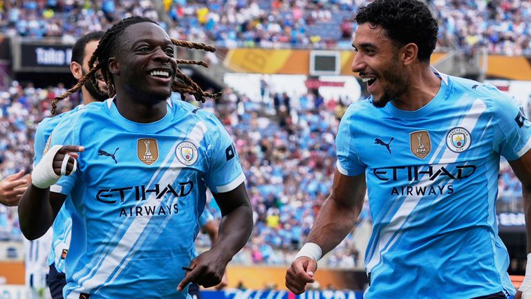 Manchester City's Jeremy Doku, left, celebrates after scoring the opening goal during the Club World Cup match against Juventus